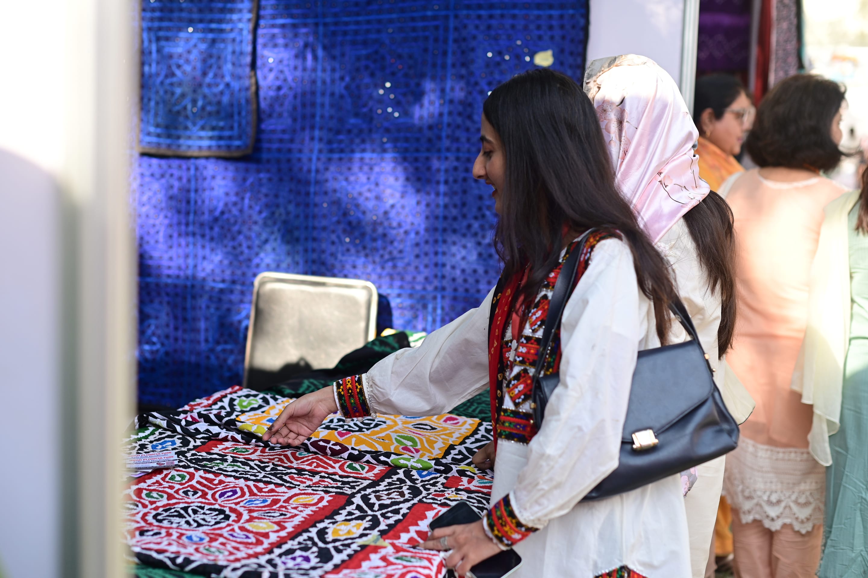 A visitor at a crafts stall
