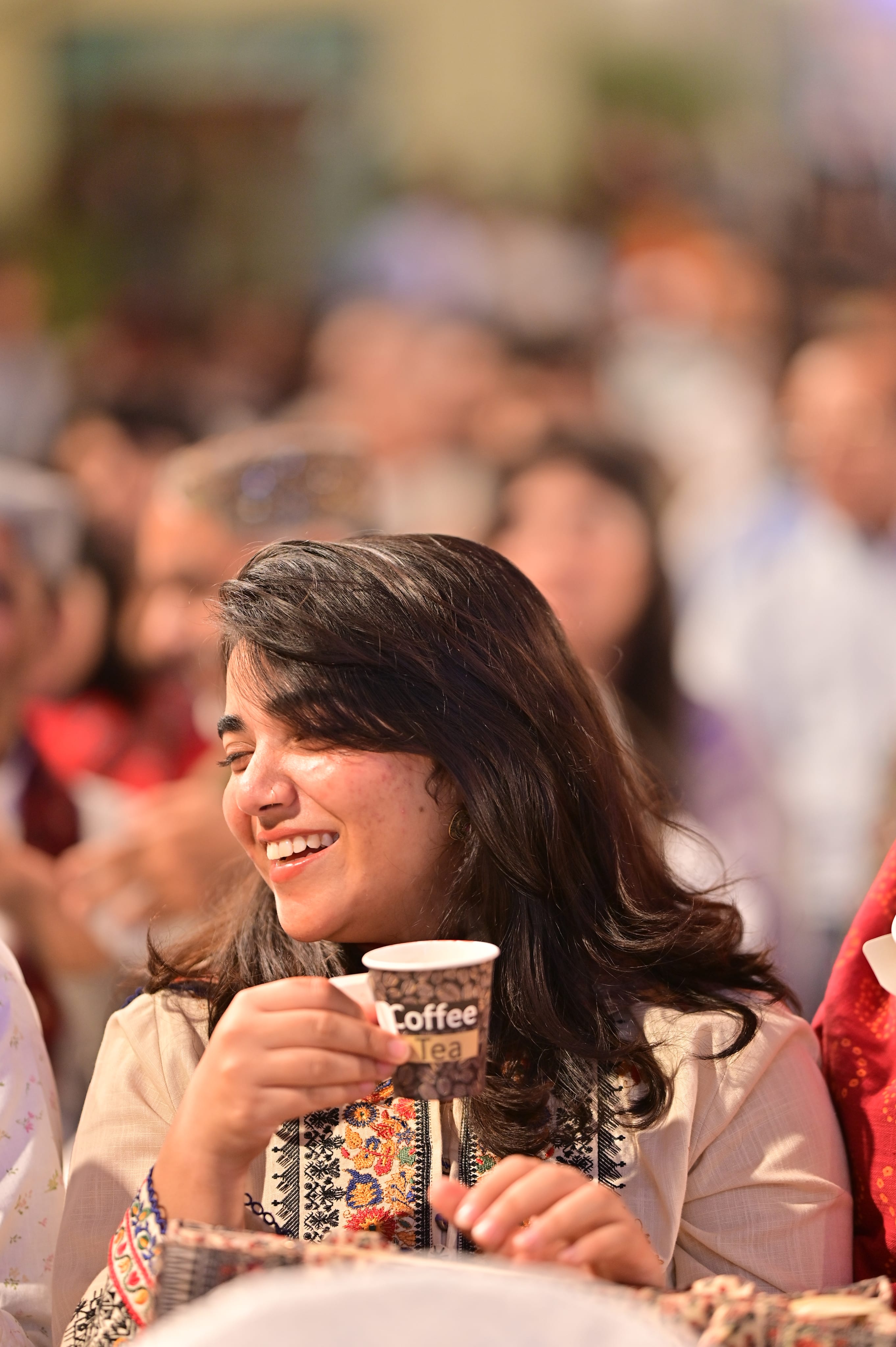 A visitor smiling at the festival